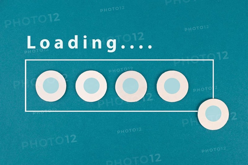 The word loading is standing over the progress bar, hand puts last cube to the row, business, education and marketing concept download a new program