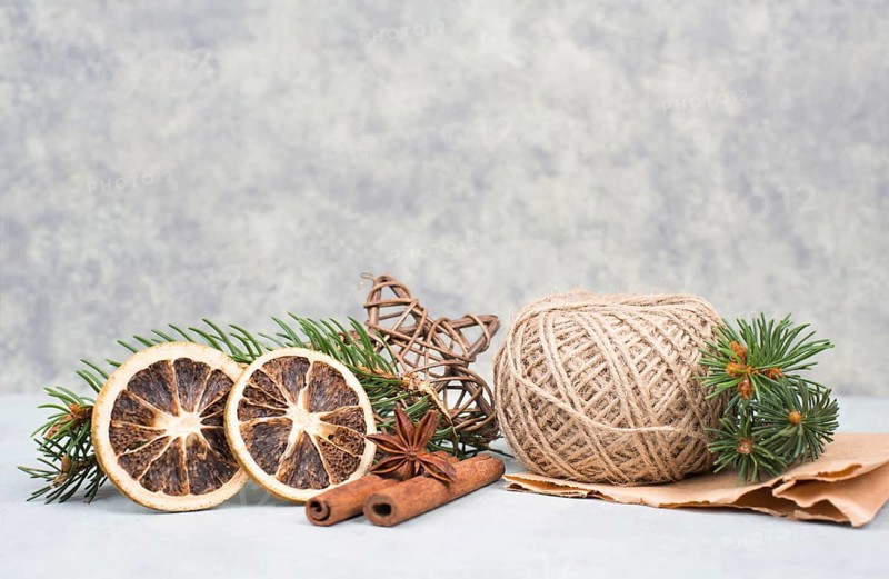 Christmas items like dried oranges, hazelnuts, fir branch, empty copy space
