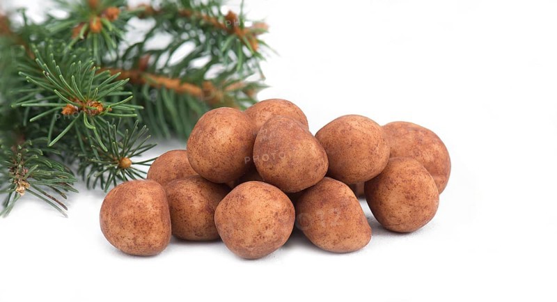 Marzipan potatoes, in german called Marzipankartoffeln, with cacao powder, sweets for christmas, empty copy space