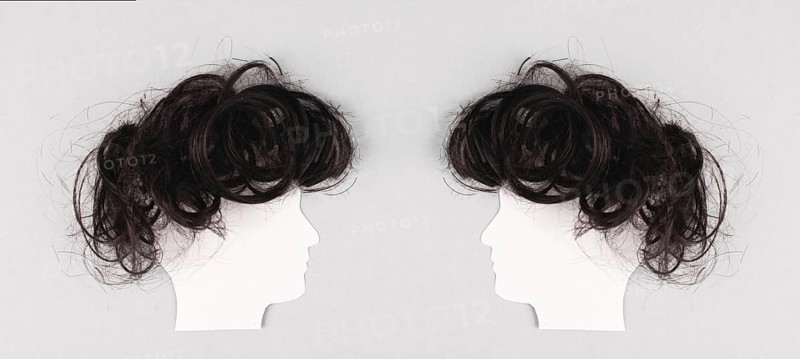 Silhouette of two faces with hair looking to each other, communication, having an opinion and discussion, free speech, people talking