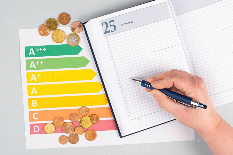 Empty paper, Euro money coins, power consumption grafic, increasing electricity costs, green technology, inflation, poverty and environmetal issue
