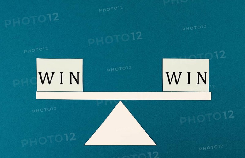 The word win is standing on paper, problem solving, winner mindset, business and education concept, coaching and motivation