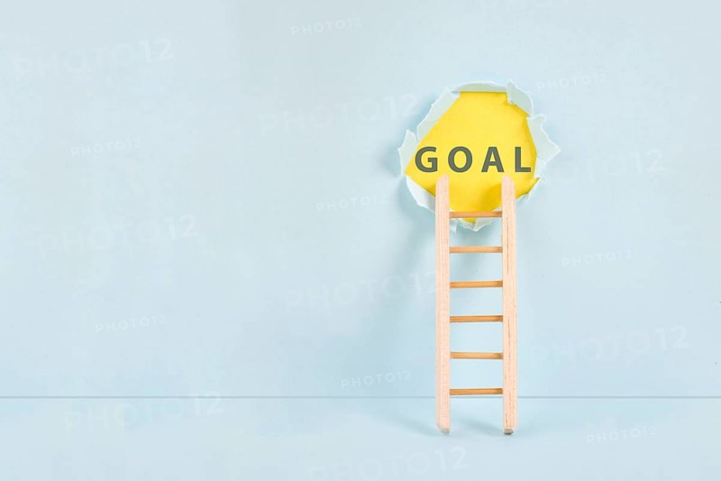 Ladder of success, having a goal, education, marketing and business concept, brainstorming for new targets, torn paper