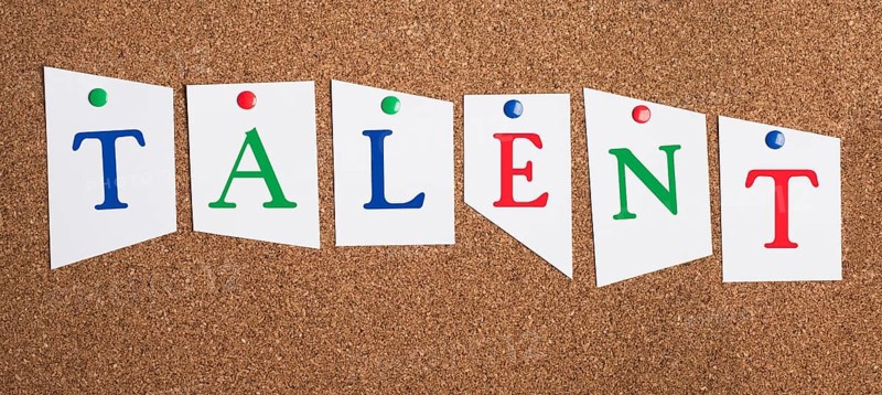 The word talent is standing in colorful letters on a corkboard, unique skill, having a passion, being gifted