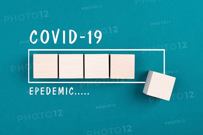 The words Covid-19 epidemic are standig beside the loading bar, end of pandemic, back to normal, post pandemic, petrol color