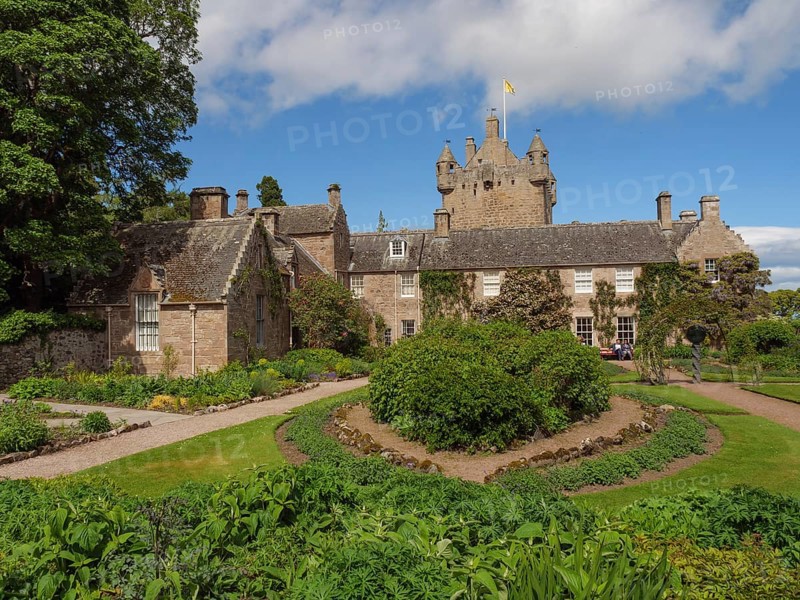 Historic castle with towers and surrounding garden, lush vegetation and a sunny sky, inverness, scotland, Great Britain