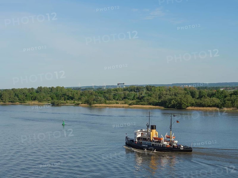 A steamboat sails on a calm river under a clear sky with green banks, Elbe, Hamburg, Northern Germany, Germany, Europe