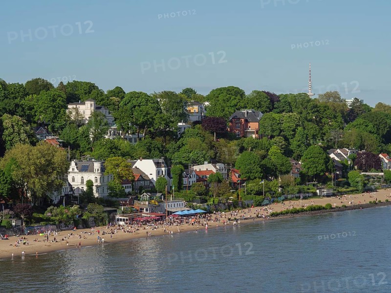 Spacious beach by the water with trees and buildings in the background, relaxed atmosphere, Elbe, Hamburg, Northern Germany, Germany, Europe