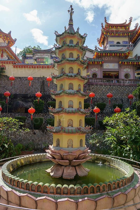 A pagoda in the centre of a water fountain in a temple complex with red lanterns, Pattaya, Thailand, Asia