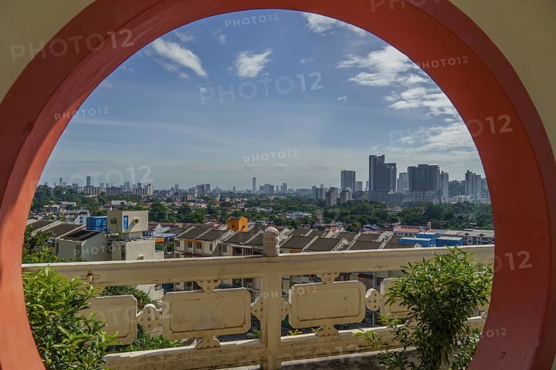 View of the city through a traditional round window, modern buildings in the background, Pattaya, Thailand, Asia