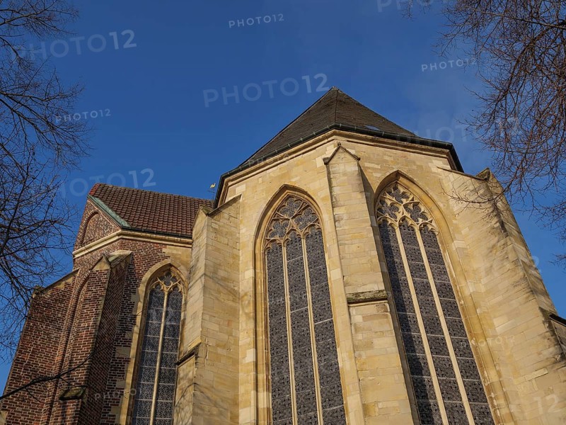 A church with large Gothic windows and a brick faÃ§ade under a clear blue sky, Coesfeld, Münsterland, North Rhine-Westphalia, Germany, Europe