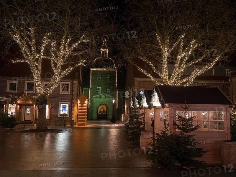 A cosy Christmas market at night, with illuminated trees and historic buildings, Ahaus, Münsterland, North Rhine-Westphalia, Germany, Europe