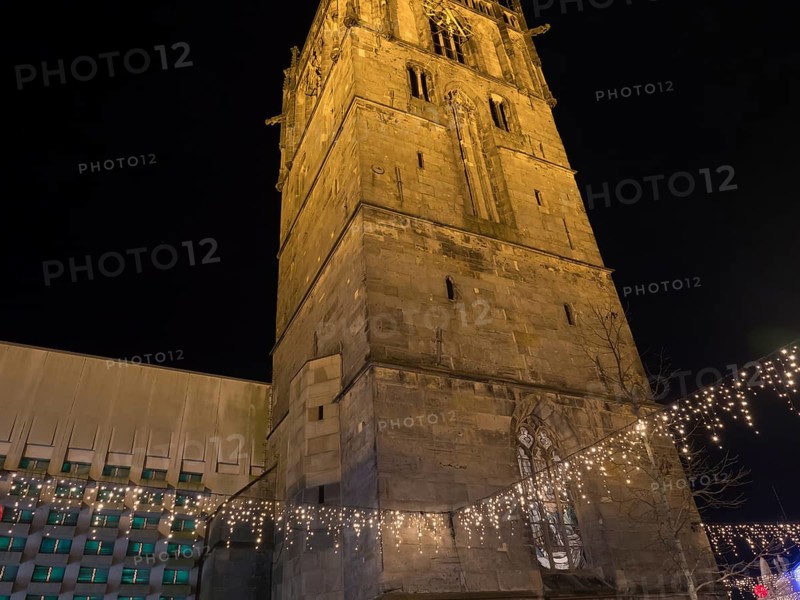 Night shot of a large church with Christmas lighting and fairy lights, Ahaus, Münsterland, North Rhine-Westphalia, Germany, Europe