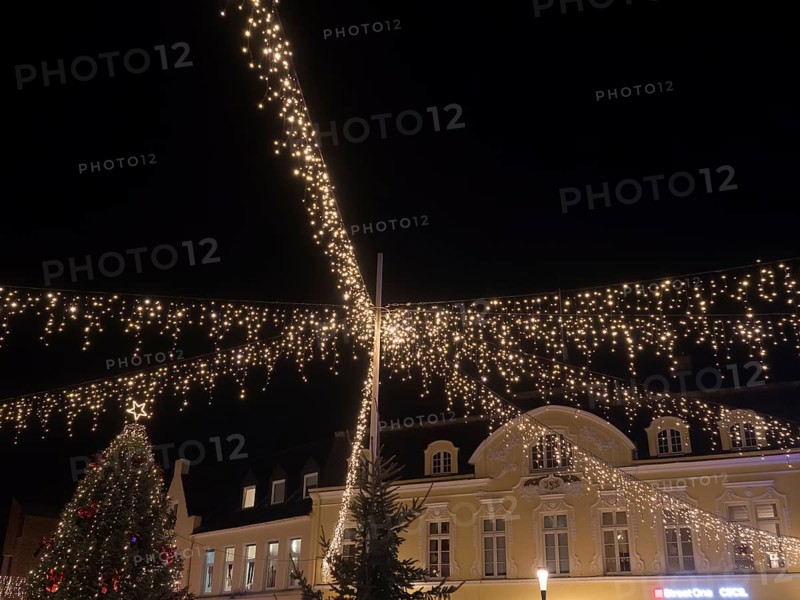 Festively illuminated scenes at night with fairy lights above a building and Christmas decorations, Ahaus, Münsterland, North Rhine-Westphalia, Germany, Europe