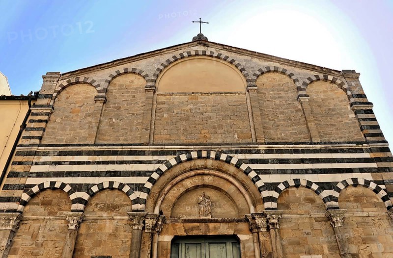 Volterra, Tuscany, Italy, Europe, Exterior view of a church with a stone faÃ§ade and a cross on top, Europe