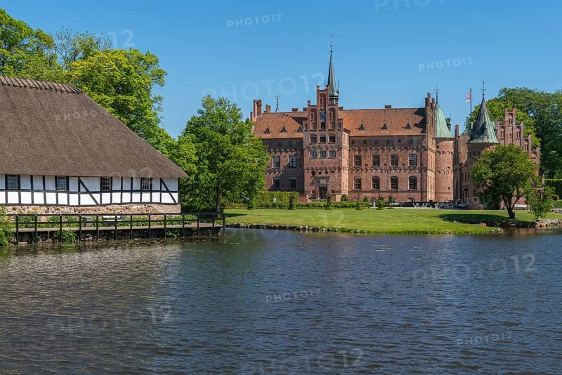 Egeskov moated castle, KvÃ¦rndrup near Svenborg, Svendburg, museum building, half-timbered house, architecture, round corner towers, stepped gables, lake, Renaissance building, tourist attraction, Fyn, Fyn Island, Denmark, Europe