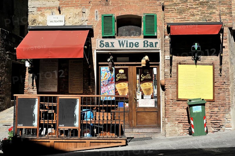 Montepulciano, Val d'Orcia, Province of Siena, Tuscany, Italy, Europe, A rustic wine bar with traditional shutters and signs on a small terrace in a historic centre, Tuscany, Europe Italy, Europe