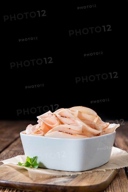 Heap of sliced Chicken Breast Fillet (selective focus, close-up shot)