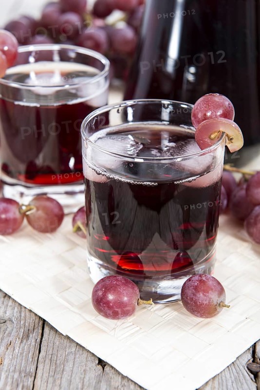Glass with Grape Juice and fresh fruits