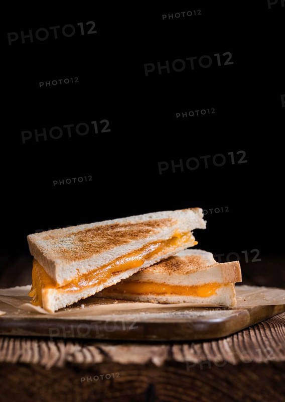 Fresh made Cheese Sandwich (selective focus) on an old wooden table