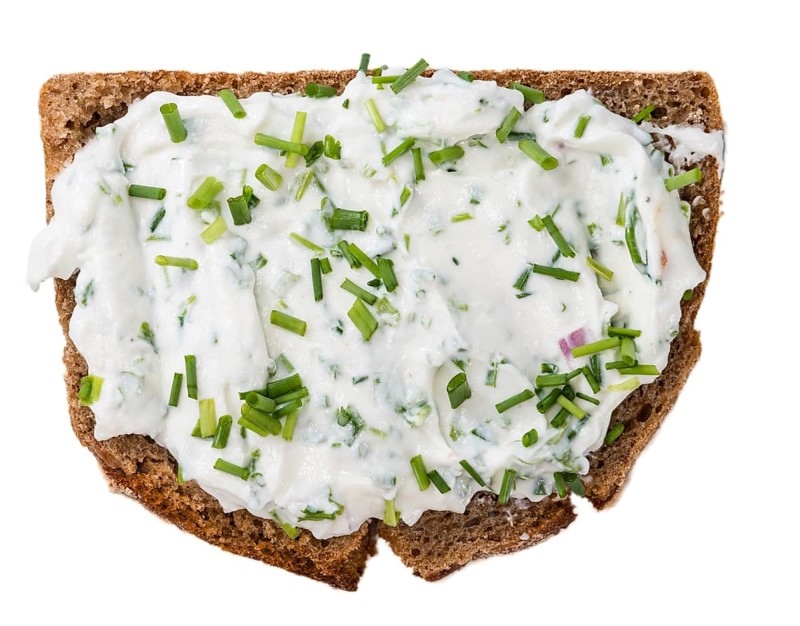 Slice of Bread with Herb Curd isolated on white background