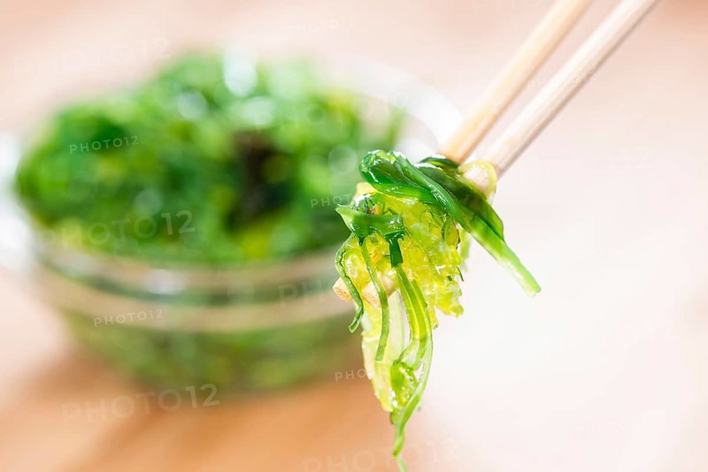 Kelp Salad (detailed close-up shot) on wooden background