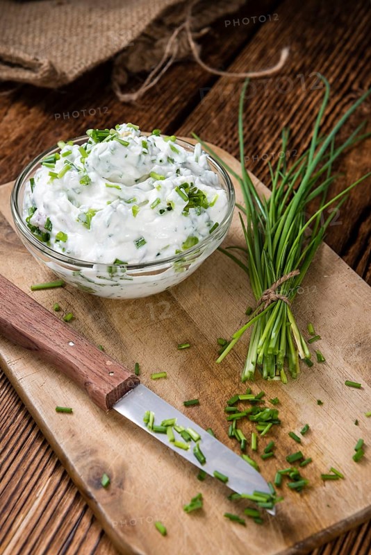 Fresh made Herb Curd (close-up shot) on vintage background