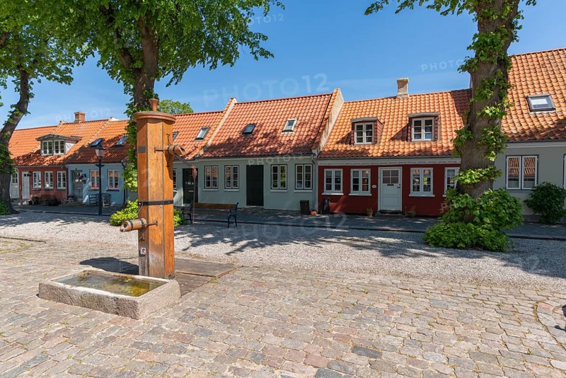 Bogense on the Kattegat, old town with colourful eaves houses, Marktpkatz, historical historic water fountain, hand pump, cobblestones, Fyn, island of Funen, Baltic Sea, Denmark, Europe