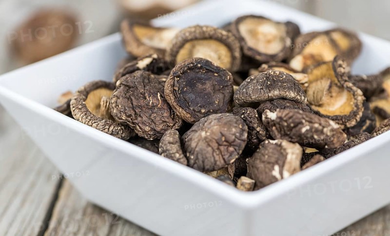 Dried Shiitake on a vintage background as detailed close-up shot, selective focus