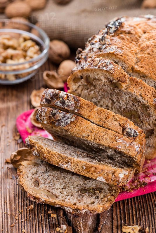 Fresh made Walnut Bread (detailed close-up shot) on wooden background