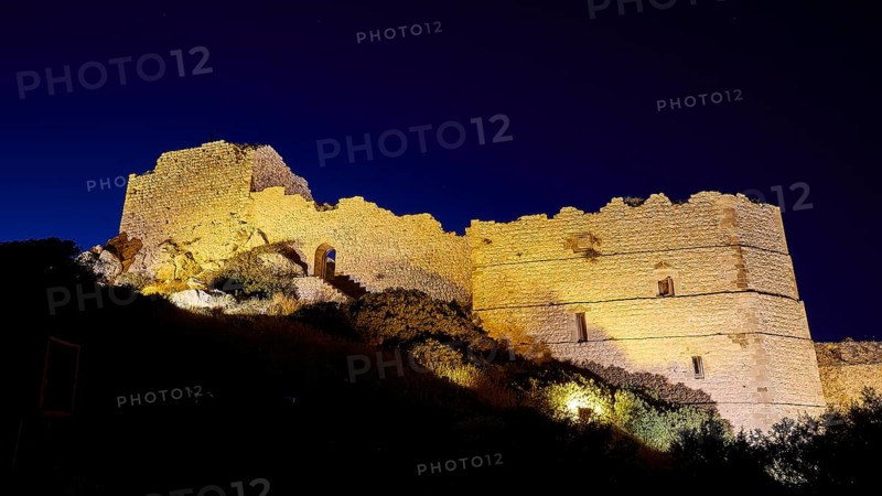 Night shot, A festively illuminated castle rises in the night, its stone walls glowing against the dark sky, Kritinia Castle, St John's Castle, Kritinia, Rhodes, Dodecanese, Greek Islands, Greece, Europe