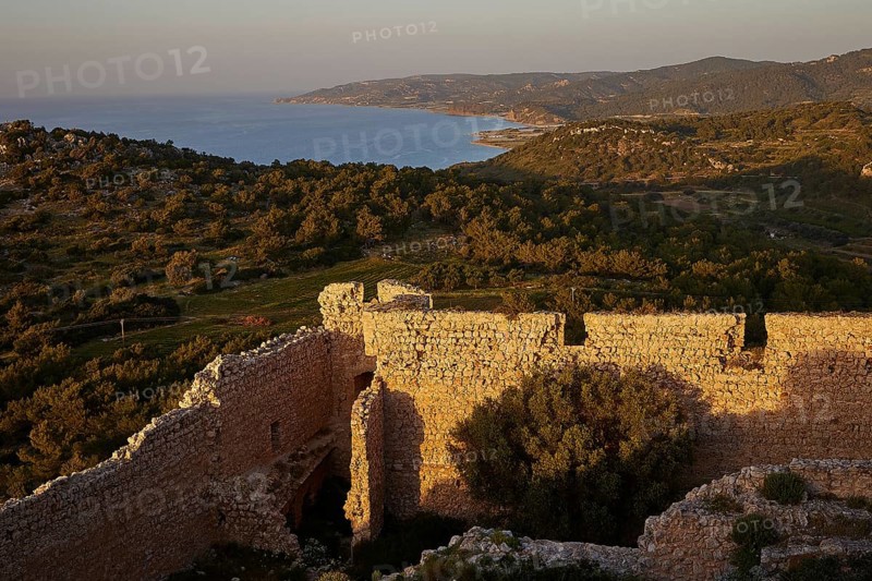 View from a stone ruin of the coastal landscape at sunset, Kritinia Castle, St John's Castle, Kritinia, Rhodes, Dodecanese, Greek Islands, Greece, Europe
