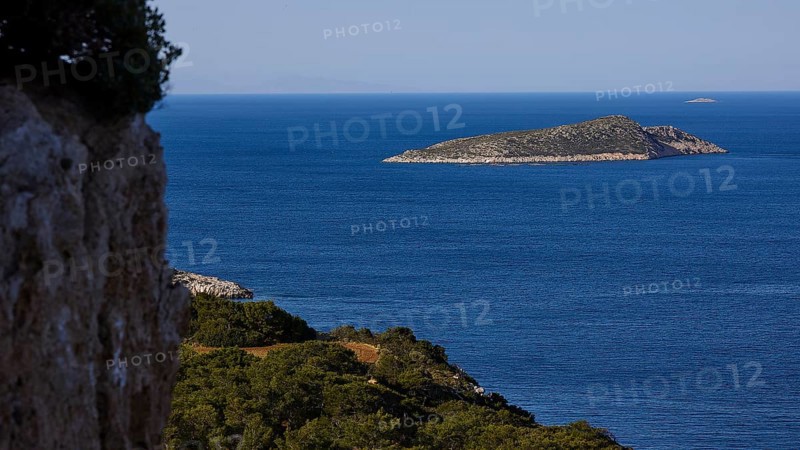 A coastal landscape with a view of an island in the blue sea and dense vegetation, Kritinia Castle, St John's Castle, Kritinia, Rhodes, Dodecanese, Greek Islands, Greece, Europe