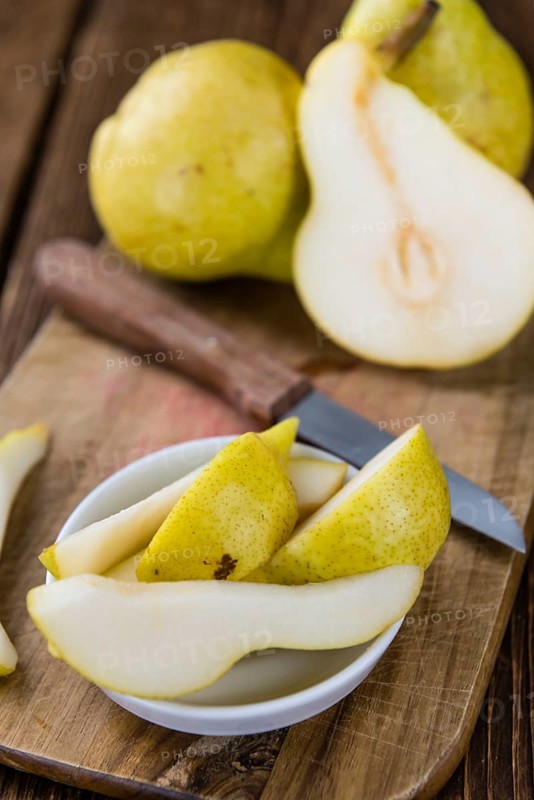 Some fresh Pears (selective focus) on wooden background