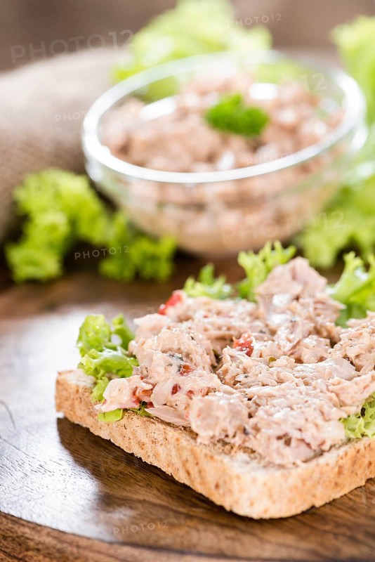 Fresh made Tuna salad sandwich on rustic wooden background