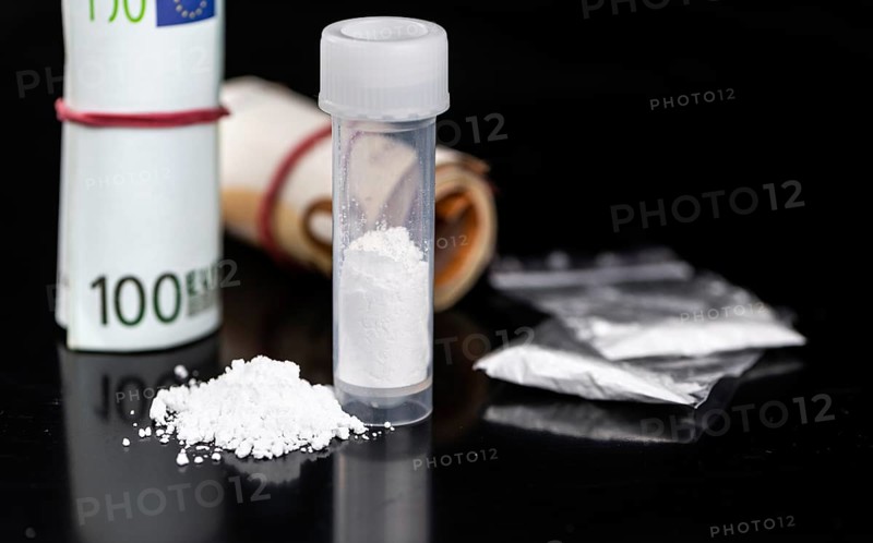 Portion of Cocaine on a dark plate as detailed close-up shot