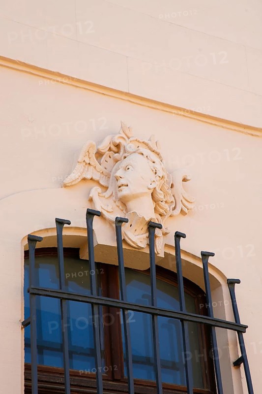 Stadion Castle Bönnigheim, detail, stone relief, window decoration, head, portrait, portrait made of stone, stucco, sculptural moulding of mortar, building, architecture, historical building, late baroque style, master builder Anton Haaf, built in 1756 on behalf of Imperial Count Anton Heinrich Friedrich von Stadion, Minister and Chancellor of the Archbishop and Elector of Mainz, country castle, summer residence, window, bars, north side, Bönnigheim, Ludwigsburg district, Baden-Württemberg, Germany, Europe