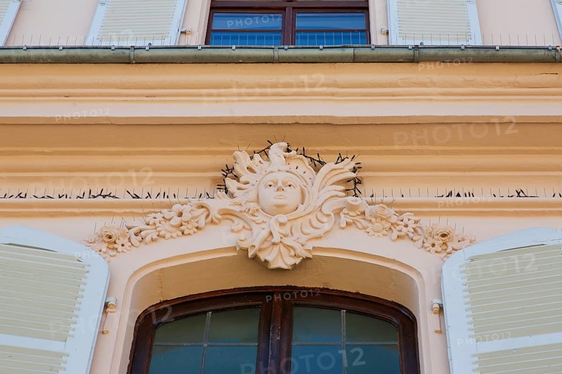 Stadion Castle Bönnigheim, detail, stone relief, window decoration, head, portrait, portrait in stone, stucco, sculptural moulding of mortar, building, architecture, historical building, late baroque style, master builder Anton Haaf, built in 1756 by order of Imperial Count Anton Heinrich Friedrich von Stadion, Minister and Chancellor of the Archbishop and Elector of Mainz, country mansion, summer residence, windows, white shutters, north side, Bönnigheim, Ludwigsburg district, Baden-Württemberg, Germany, Europe