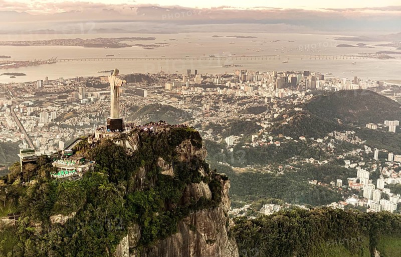 Cristo Redentor statue in Rio de Janeiro (aerial shot made from a helicopter) during a spectacular sunset