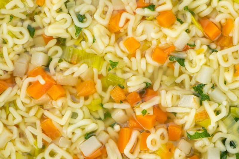 Portion of fresh made Alphabet Soup (selective focus, close-up shot)