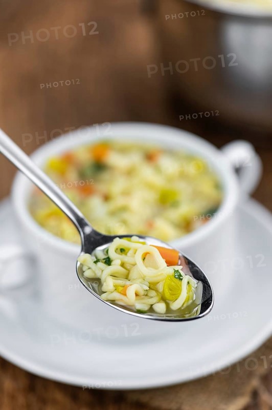 Portion of homemade Alphabet Soup (selective focus, close-up shot)