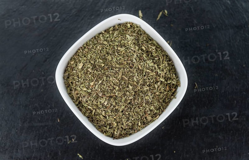 Dried Stevia leaves (selective focus) on vintage background