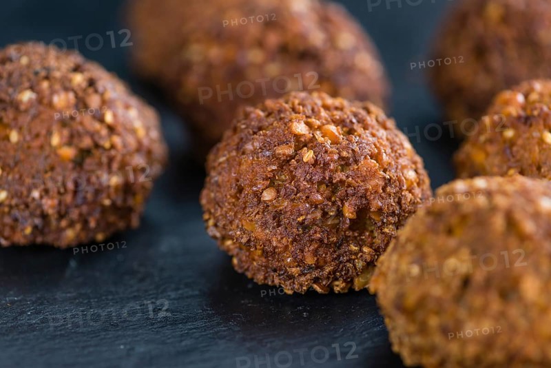 Falafel (close-up shot, selective focus) on an old wooden table