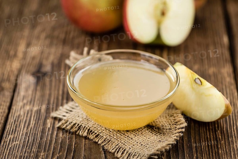 Portion of Applesauce (selective focus) on vintage background (close-up shot)