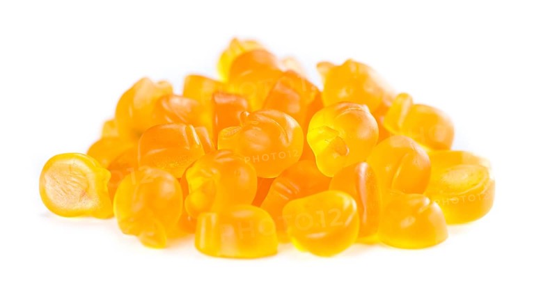 Gummy Peaches (close-up shot) isolated on white background