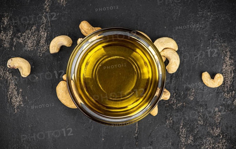 Fresh made Cashew Oil (detailed close up shot, selective focus)
