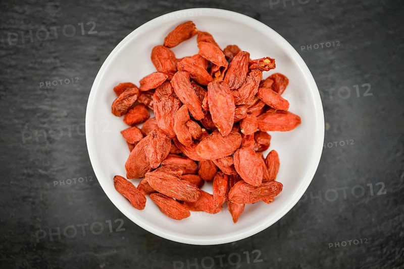 Goji Berries on a vintage background as detailed close-up shot (selective focus)