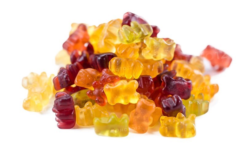 Heap of Gummy Bears (close-up shot) isolated on white background