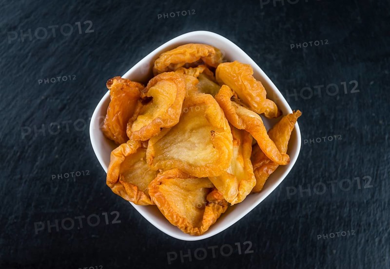 Slate slab with dried Pears (close-up shot, selective focus)