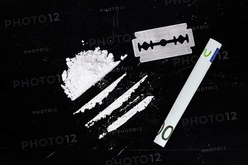 Portion of Cocaine on a dark plate as detailed close-up shot